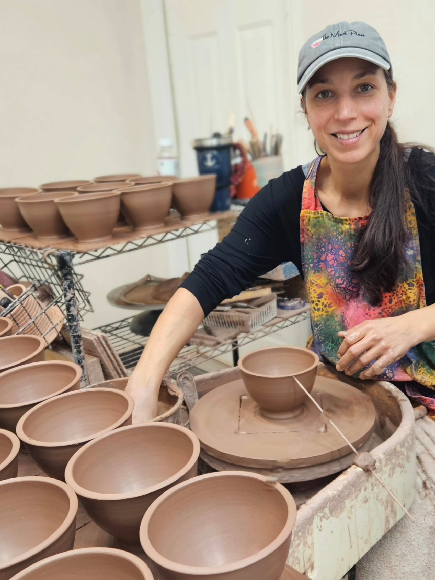 Leslie from The Mud Place throwing bowls in her studio in Melbourne, FL.