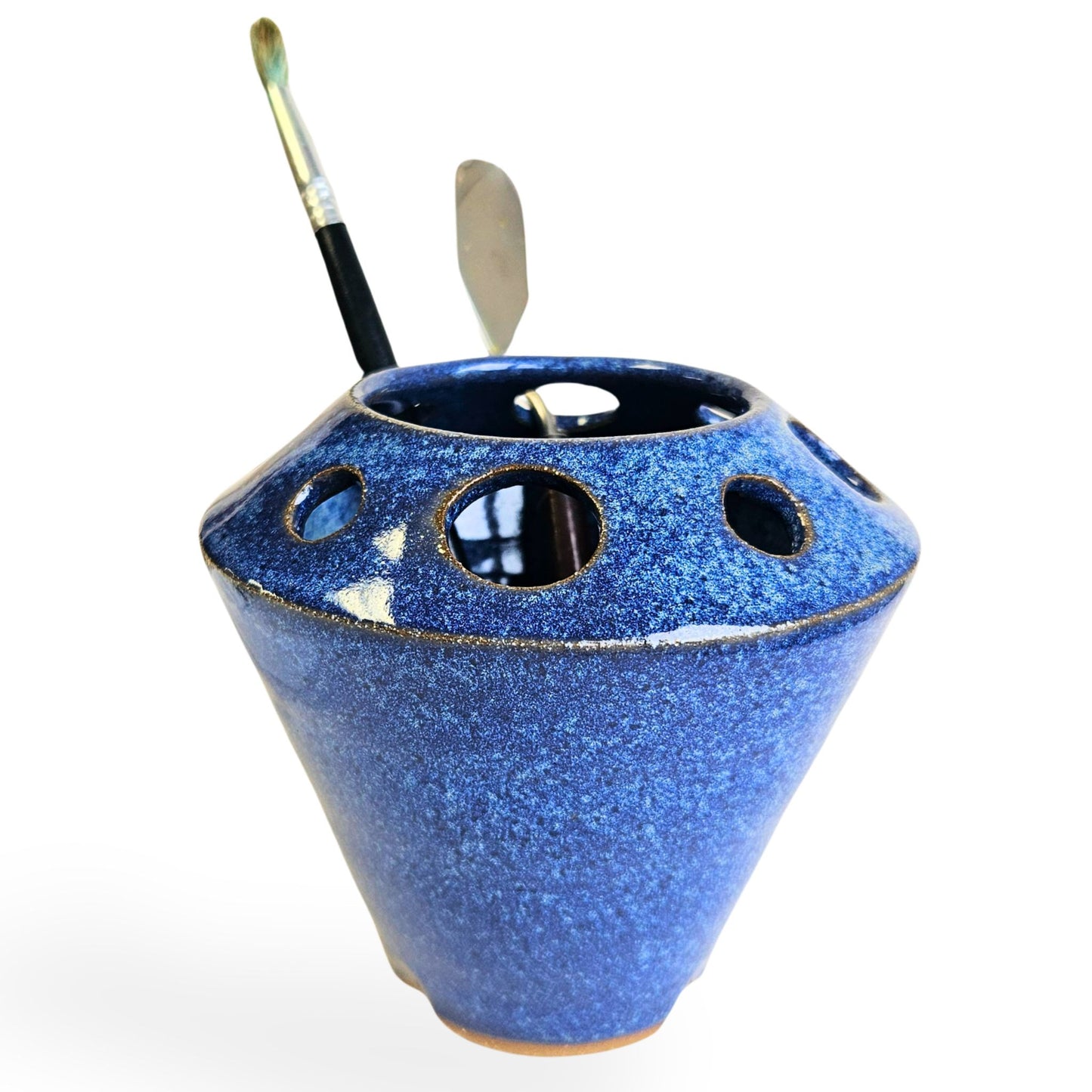 Handmade ceramic pottery tool caddy in blue speckled glaze, featuring a flared cone shape with multiple round openings around the rim for organizing art supplies, pens, pencils, brushes, or scissors. Unique handcrafted desk organizer, perfect for artists, crafters, or pottery lovers.