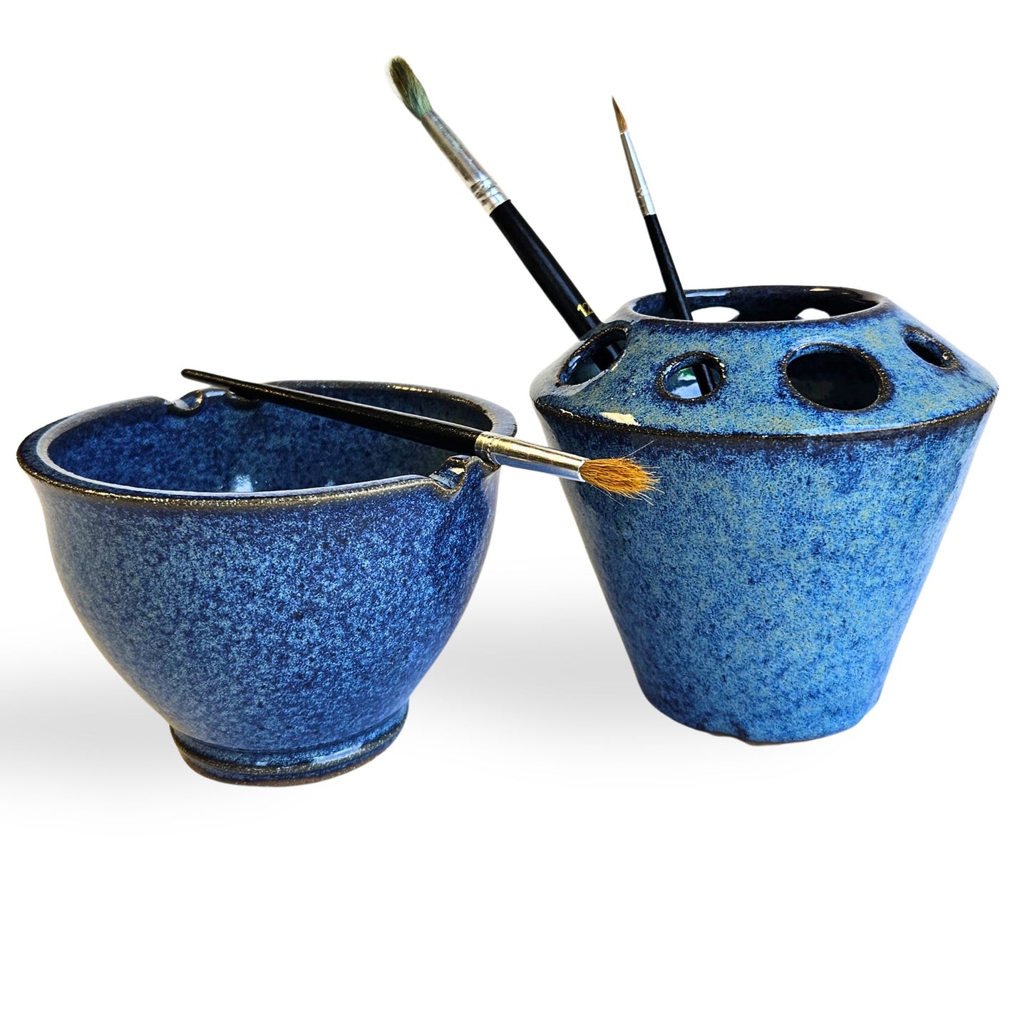 Handmade ceramic watercolor painting set with matching blue brush rinse bowl and coordinating pottery tool caddy. Features built-in brush rests, multiple tool slots for pens, pencils, or paintbrushes, and durable dishwasher-safe stoneware. Perfect for artists, painters, and crafters.