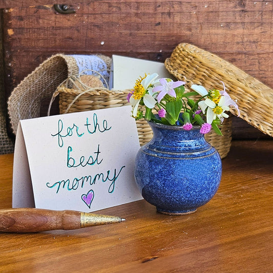 Handmade ceramic Mommy Pot in beautiful blue glaze, featuring a wildflower bouquet and "for the best mommy" card – a meaningful keepsake for Mother's Day, birthdays, or thinking-of-you gifts.