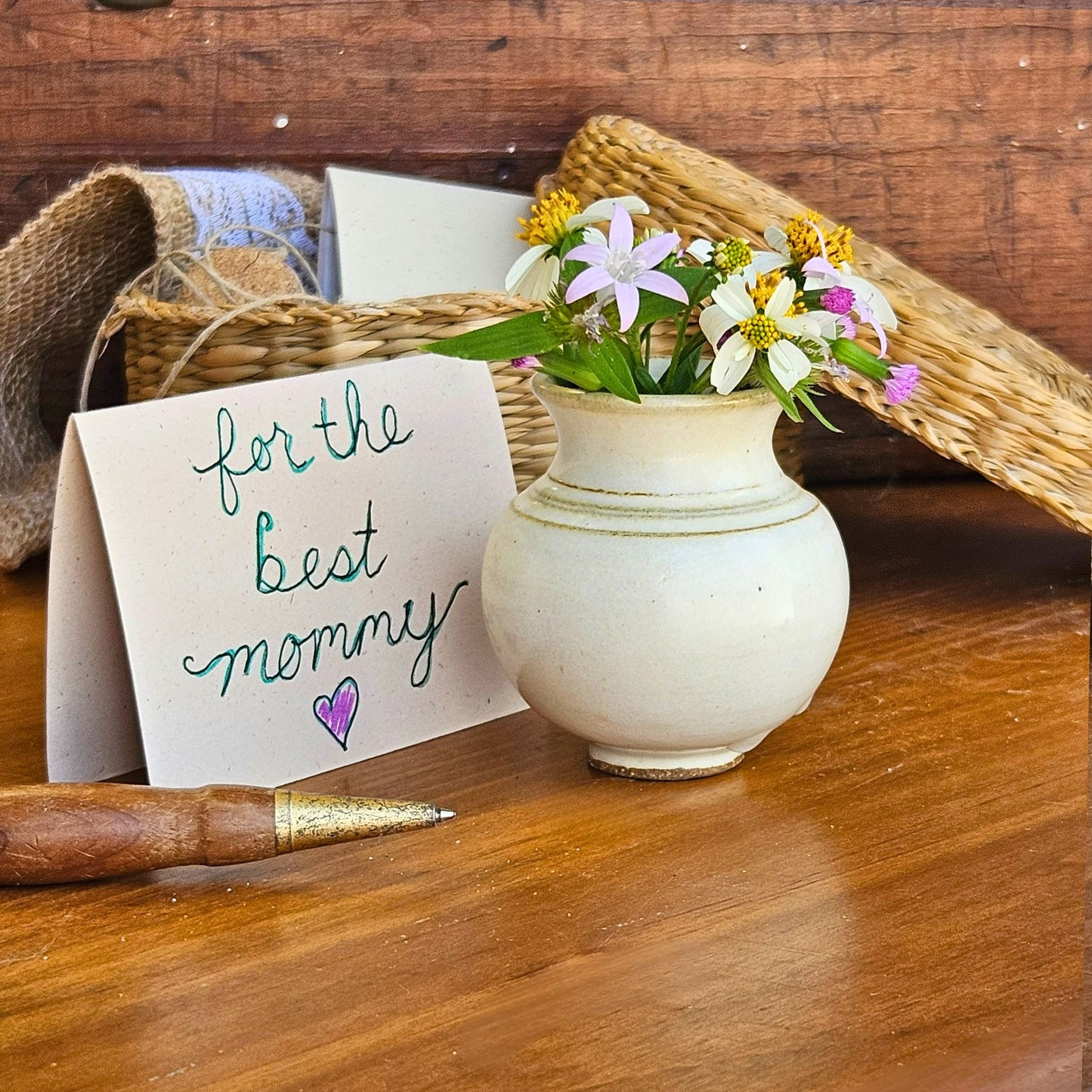 Handmade ceramic Mommy Pot in soft yellow glaze, featuring a wildflower bouquet and "for the best mommy" card – a meaningful keepsake for Mother's Day, birthdays, or thinking-of-you gifts.