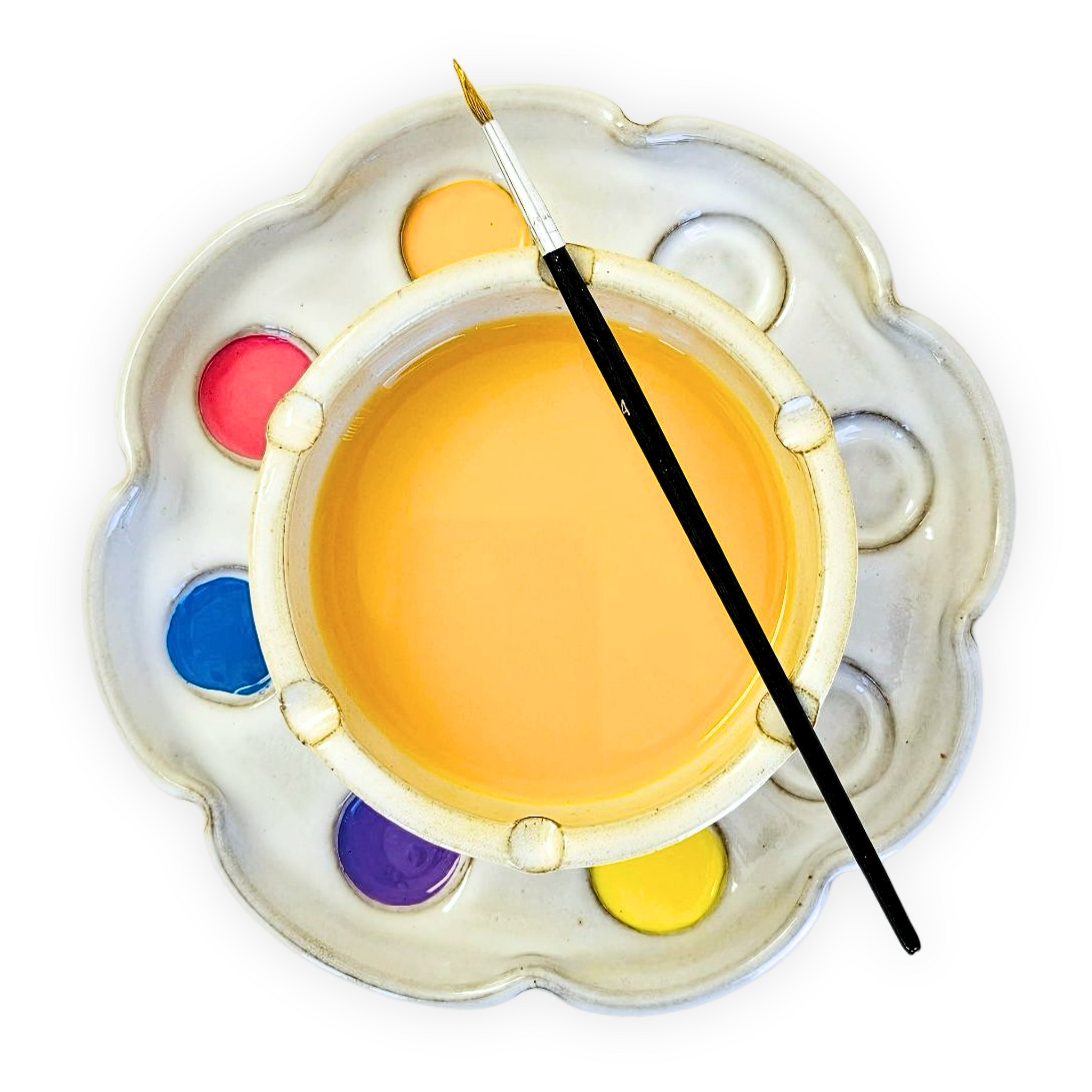top view of a flower shaped paint palette and rinse bowl holding bright paints in 8 wells and a paint brush resting on top of the water rinse bowl