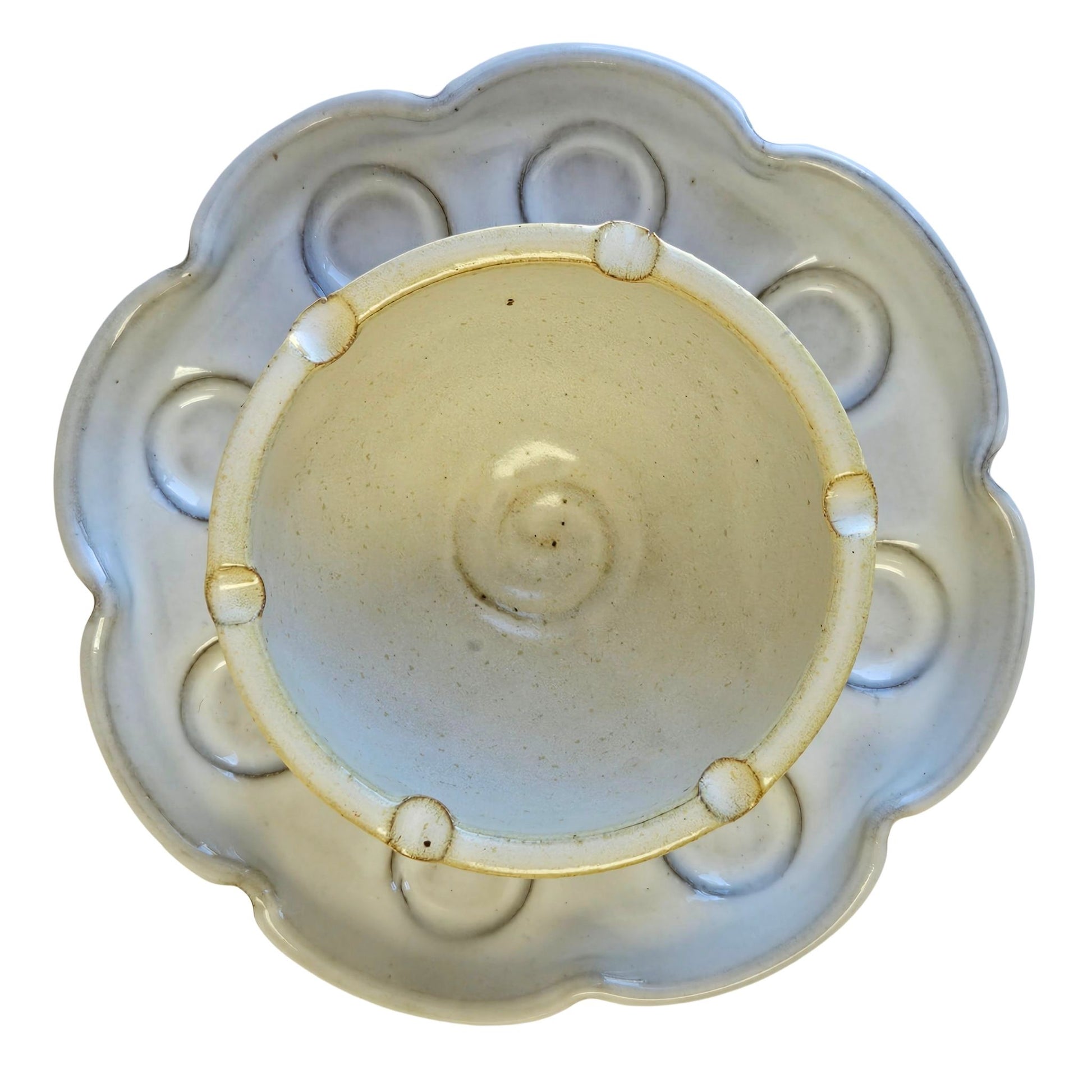 Overhead photo of the Petal Palette that feature convenient Brush Rests, Nests into a charming flower shape, compact foot design to save counter space, 8 individual paint wells, spacious well for blending. 