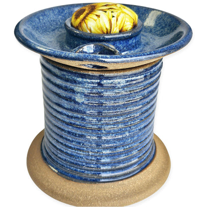 Handmade ceramic sewing caddy shaped like an oversized spool, in vibrant blue glazes, with a fabric-topped pincushion, scissors slot, and removable lid for storage. sunflower pincushion fabric