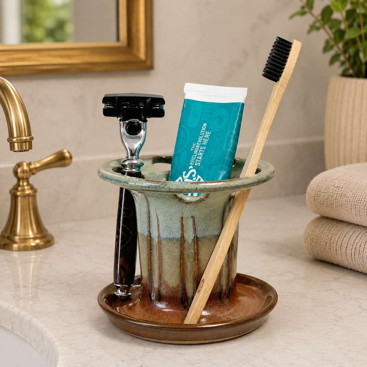 Spa-inspired organized bathroom vanity with toothbrush and toothpaste storage and built-in shaving razor holder
