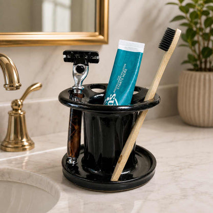 Clutter-free bathroom sink with black toothbrush organizer, toothpaste storage and shaving razor holder