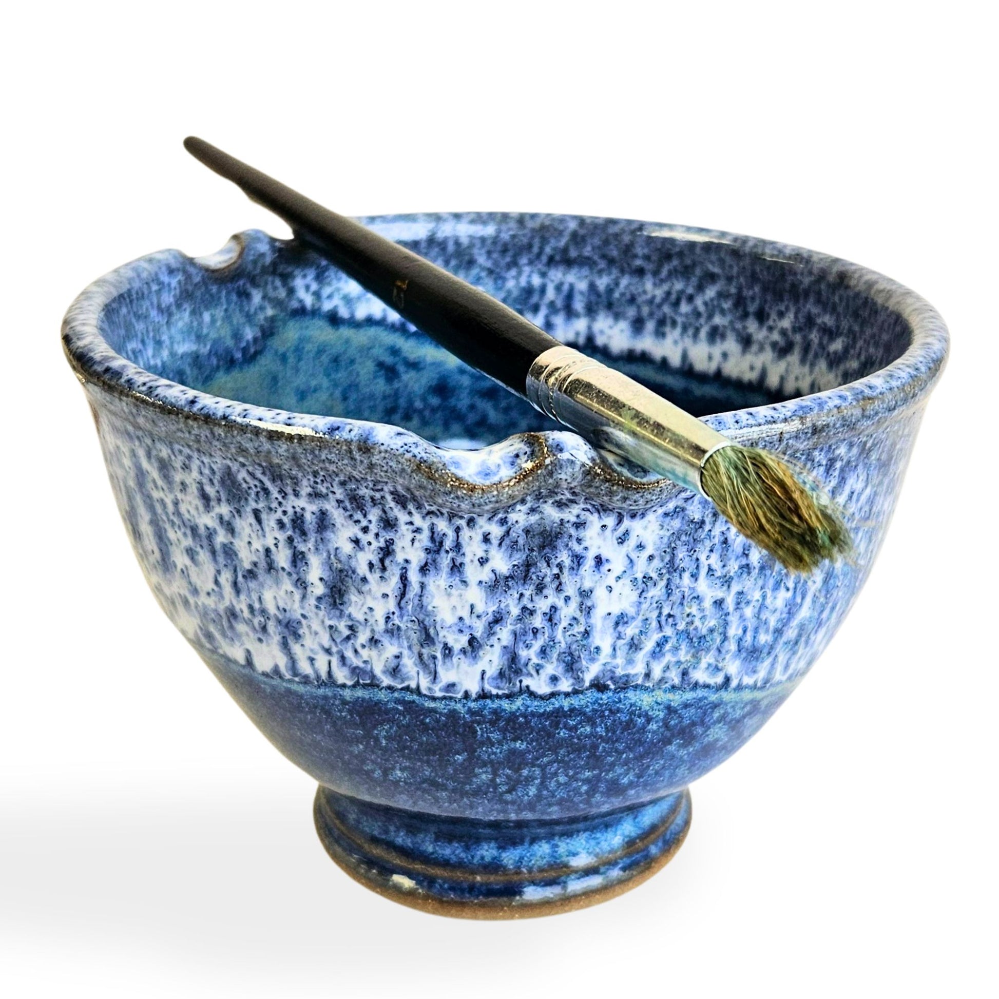 Handmade stoneware brush rinse bowl with two offset brush rests on the rim and swirl design on the bottom for cleaner brushes. Dishwasher-safe ceramic bowl designed by artists for artists.