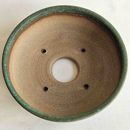 Interior of a 6.75-inch shohin bonsai pot with one drainage hole and four tie-down holes for repotting.