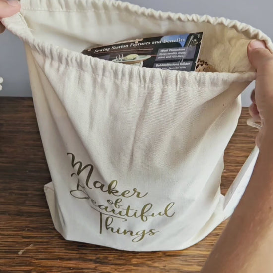 Video for Canvas Project Gift Bag Wrap. Reusable canvas gift bag with gold “Maker of Beautiful Things” script and a gift tag that reads “Given with Love, Made with Heart.” A perfect gift wrap for handmade items, pottery, or artisan gifts — ideal for Christmas, Mother’s Day, or holiday gifting option for The Mud Place. 