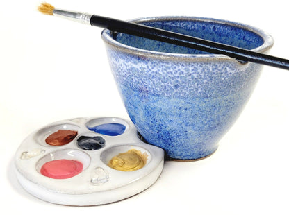 Handmade blue and white speckled ceramic watercolor rinse bowl and white paint palette with brush for artists.