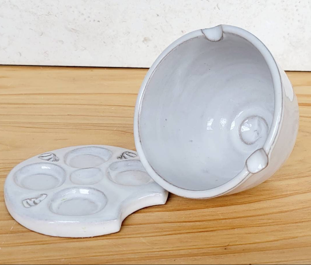 Two-piece white stoneware watercolor palette and rinse bowl gift set for artists, shown on a clean creative workspace.