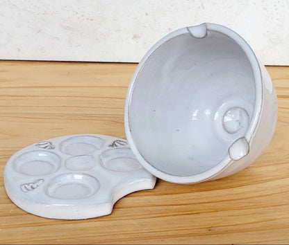 Two-piece white stoneware watercolor palette and rinse bowl gift set for artists, shown on a clean creative workspace.